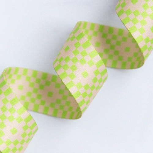 Bitmapped Neon Yellow 1.5-inch polyester webbing by Rashida Coleman-Hale featuring a neon yellow-green and soft cream pixel-style checker pattern.