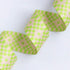 Bitmapped Neon Yellow 1.5-inch polyester webbing by Rashida Coleman-Hale featuring a neon yellow-green and soft cream pixel-style checker pattern.