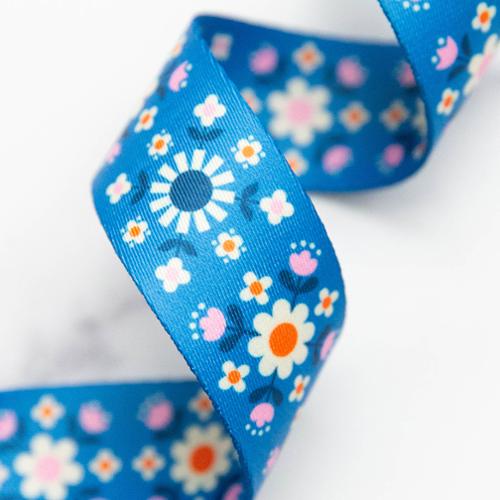 bright blue floral webbing with retro daisy print for bag straps