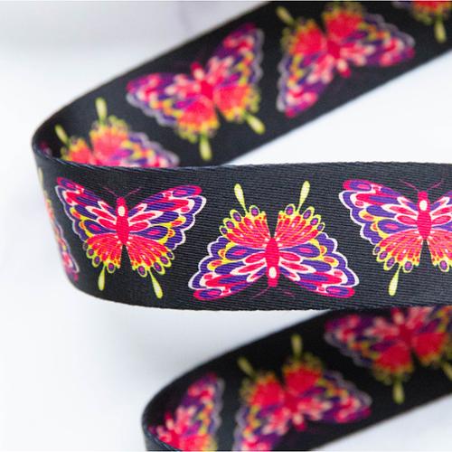black webbing with colorful glow moths for bag making and sewing projects