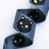 Snacks Cat 1.5-inch polyester webbing by Sarah Watts featuring black cat faces with lime green accents on a slate blue background.