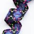 Dragonfly Pixels 1.5-inch polyester webbing by Sarah Watts featuring purple and blue dragonfly motifs with pink and lime green geometric accents on black.