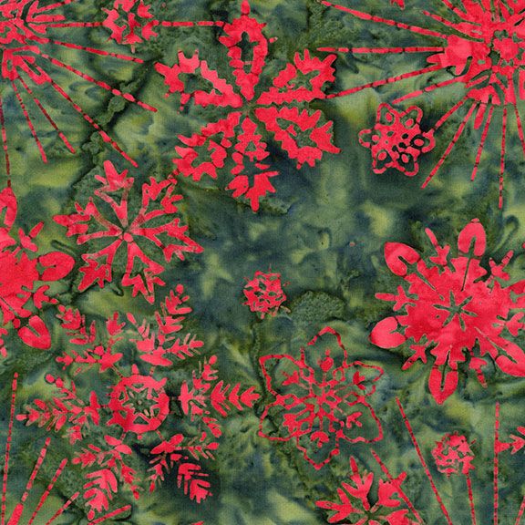 Red snowflake Christmas batik fabric on a green mottled background from the Tonga Holiday Batik collection by Timeless Treasures.