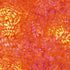 Orange and pink batik fabric featuring cascading vine leaves and botanical motifs from the Tonga Batik collection by Timeless Treasures.