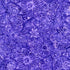 Purple floral batik fabric featuring detailed botanical flowers and leaves from the Tonga Spring Floral collection by Timeless Treasures.