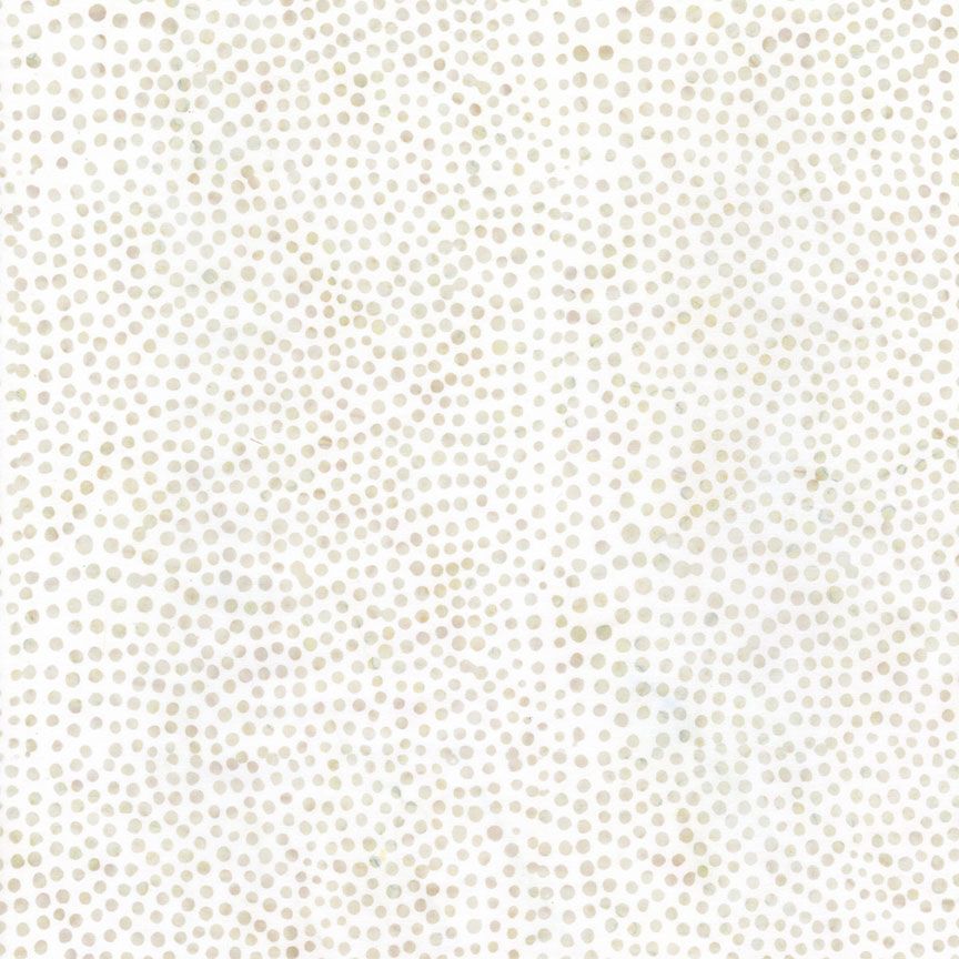 Ivory and cream batik fabric featuring densely packed wavy dot patterns from the Tonga Batik collection by Timeless Treasures.