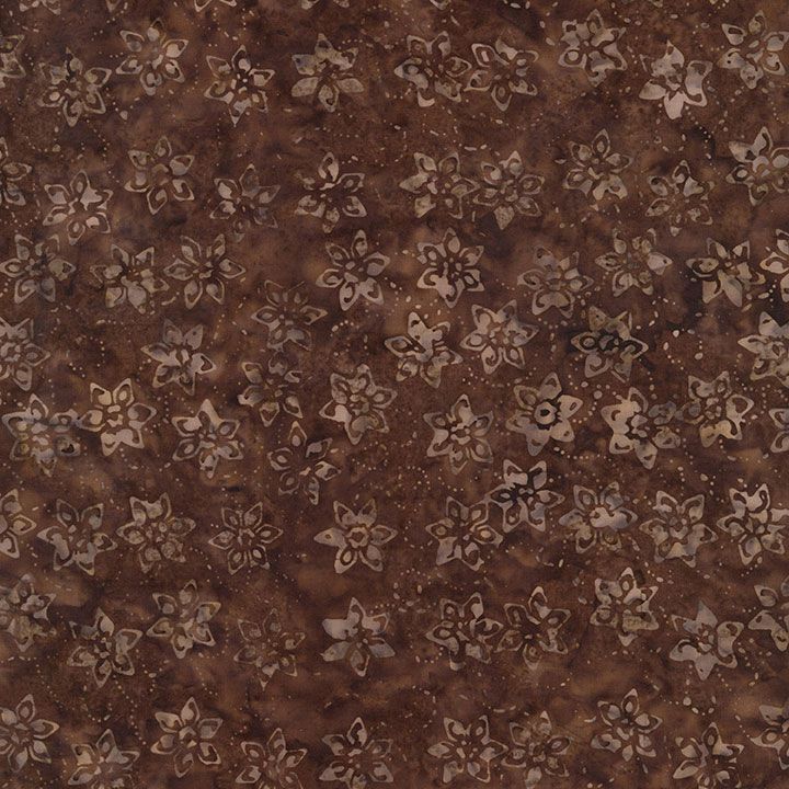 Brown batik fabric featuring scattered daffodil floral motifs on a textured truffle background from the Tonga Batik collection by Timeless Treasures.