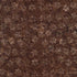 Brown batik fabric featuring scattered daffodil floral motifs on a textured truffle background from the Tonga Batik collection by Timeless Treasures.