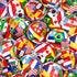 Fabric with soccer balls covered in international flags including USA, Canada, Brazil, Spain, France, and more on a colorful background.