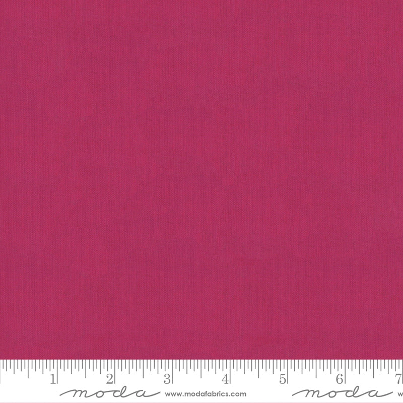 Crossweave Garnet woven cotton fabric featuring a rich garnet pink linen-look texture by Moda Fabrics.