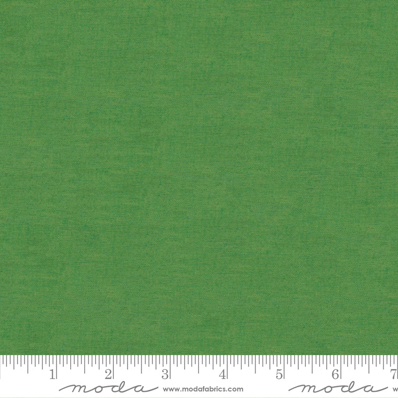 Crossweave Shamrock woven cotton fabric featuring a vibrant shamrock green linen-look texture by Moda Fabrics.