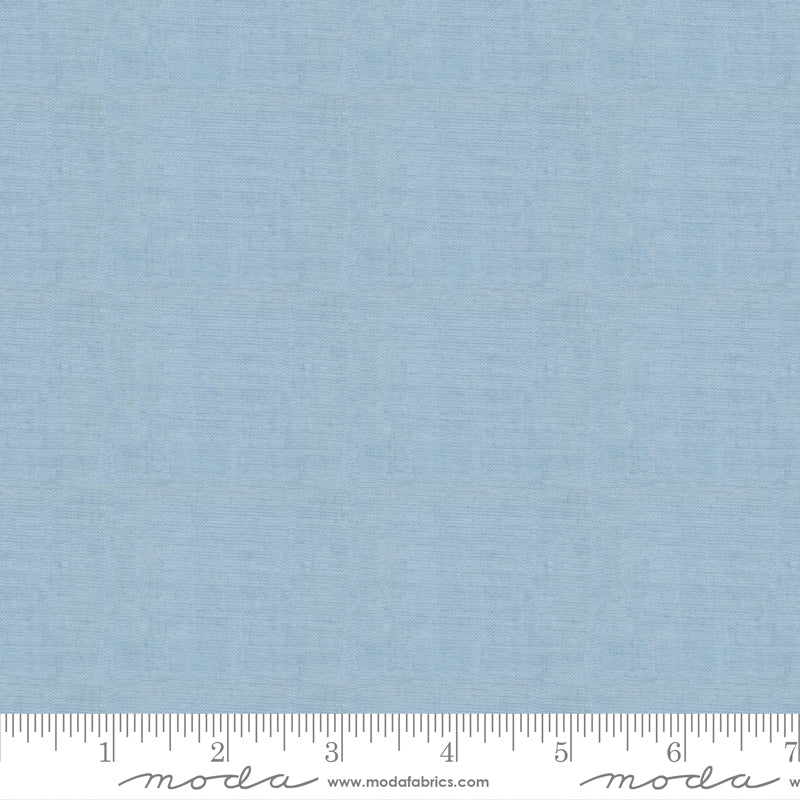 Crossweave Glacier woven cotton fabric featuring a soft glacier blue linen-look texture by Moda Fabrics.