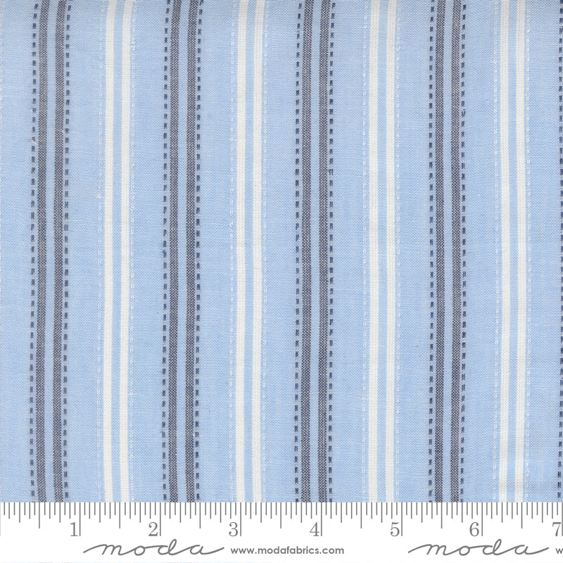 Summer Solstice Wovens Ticking Stripe Waterfall woven cotton fabric featuring sky blue, ivory, and navy vertical ticking stripes by Pieces To Treasure for Moda Fabrics.
