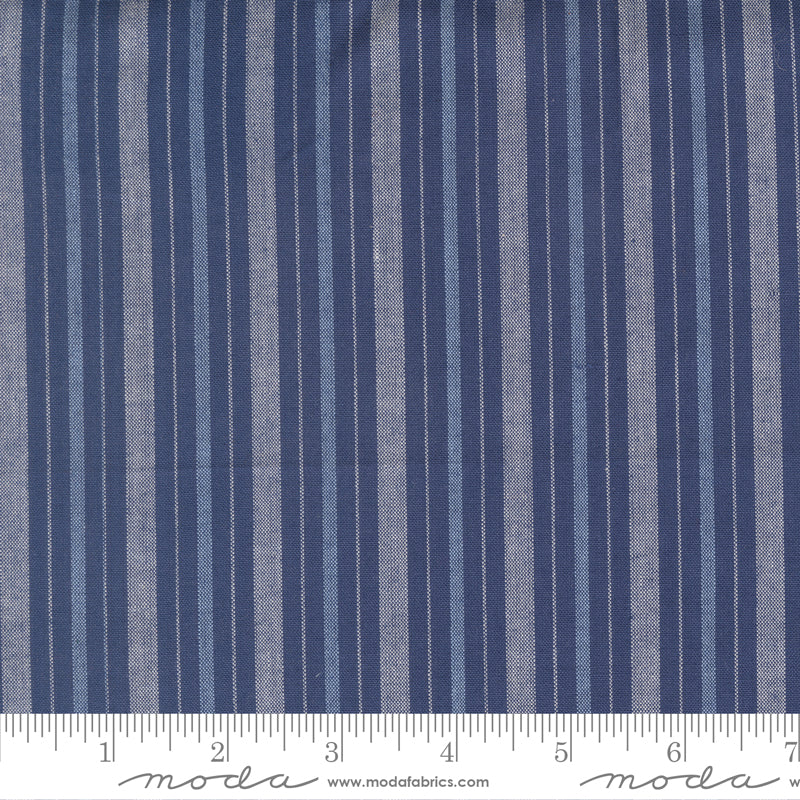 Summer Solstice Wovens Simple Stripe Nautical Blue woven cotton fabric featuring alternating navy blue, soft blue, and ivory stripes by Pieces To Treasure for Moda Fabrics.