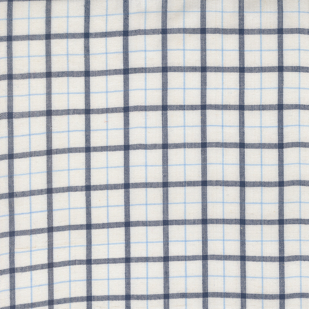Summer Solstice Wovens Windowpane Nautical Blue woven cotton fabric featuring navy and sky blue windowpane plaid on an ivory background by Pieces To Treasure for Moda Fabrics.
