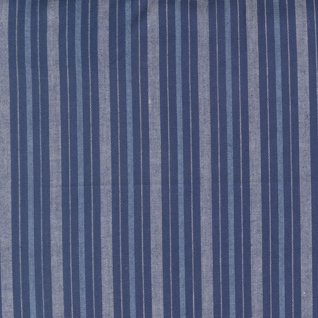 Summer Solstice Wovens Simple Stripe Nautical Blue woven cotton fabric featuring alternating navy blue, soft blue, and ivory stripes by Pieces To Treasure for Moda Fabrics.