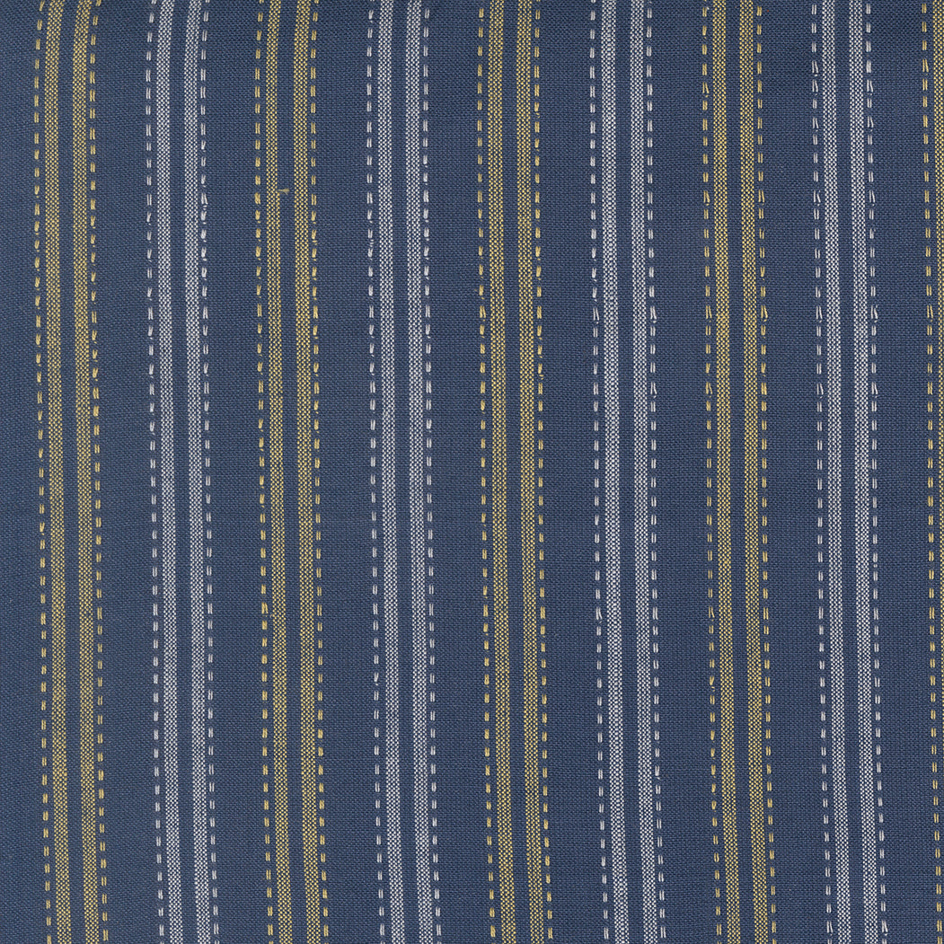 Summer Solstice Wovens Ticking Stripe Nautical Blue woven cotton fabric featuring navy blue, ivory, and golden ticking stripes by Pieces To Treasure for Moda Fabrics.