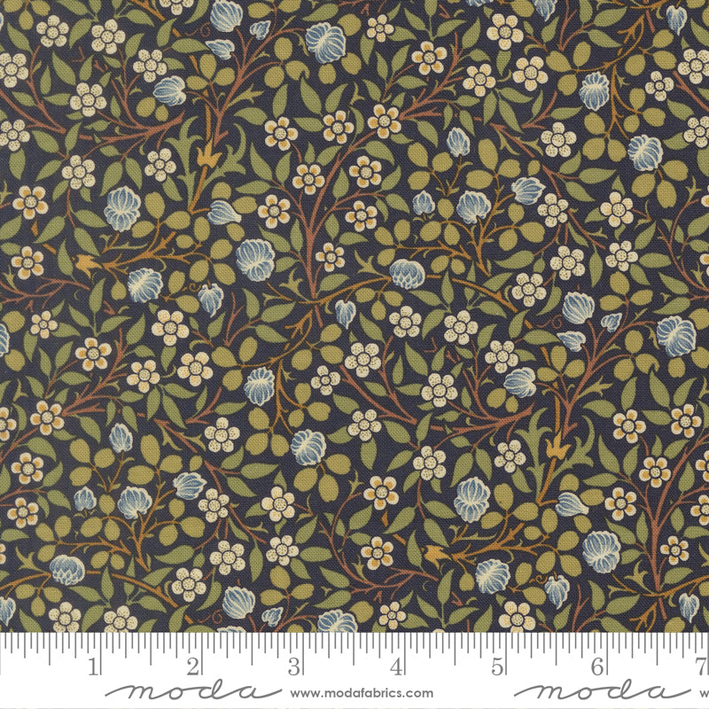 Morris Muse Clover Twilight quilting cotton by Barbara Brackman for Moda Fabrics featuring delicate blue clover blossoms, tiny white flowers, and trailing botanical vines on a twilight blue background.