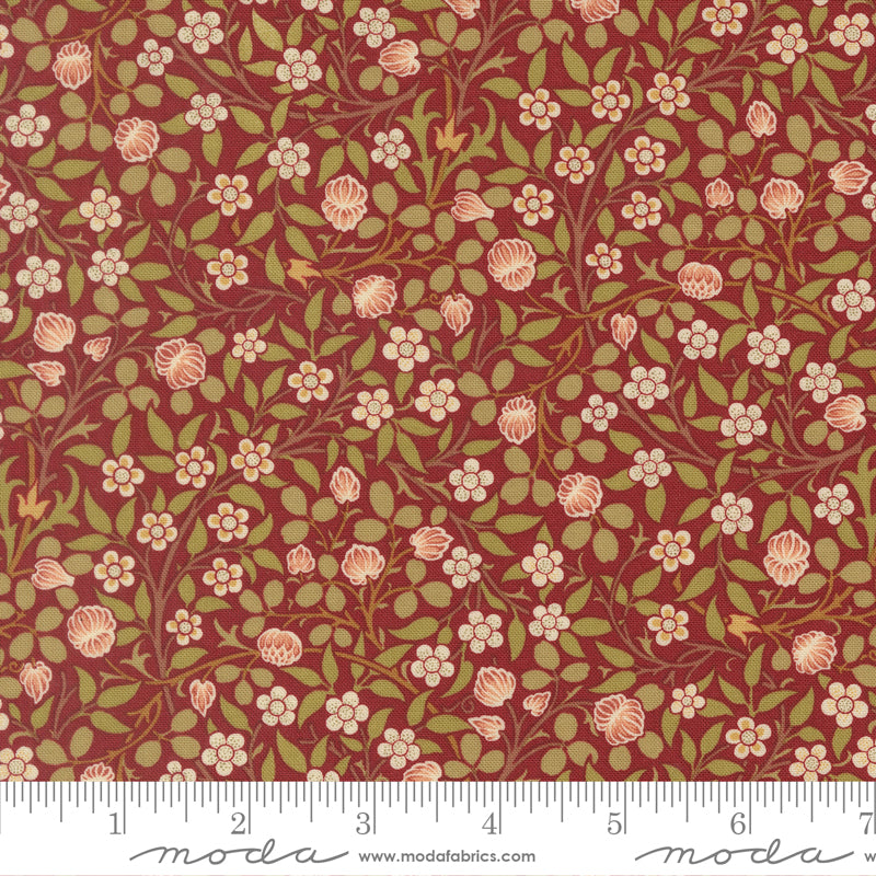 Morris Muse Clover Russet quilting cotton by Barbara Brackman for Moda Fabrics featuring delicate blush clover blossoms, tiny white flowers, and trailing botanical vines on a warm russet background.