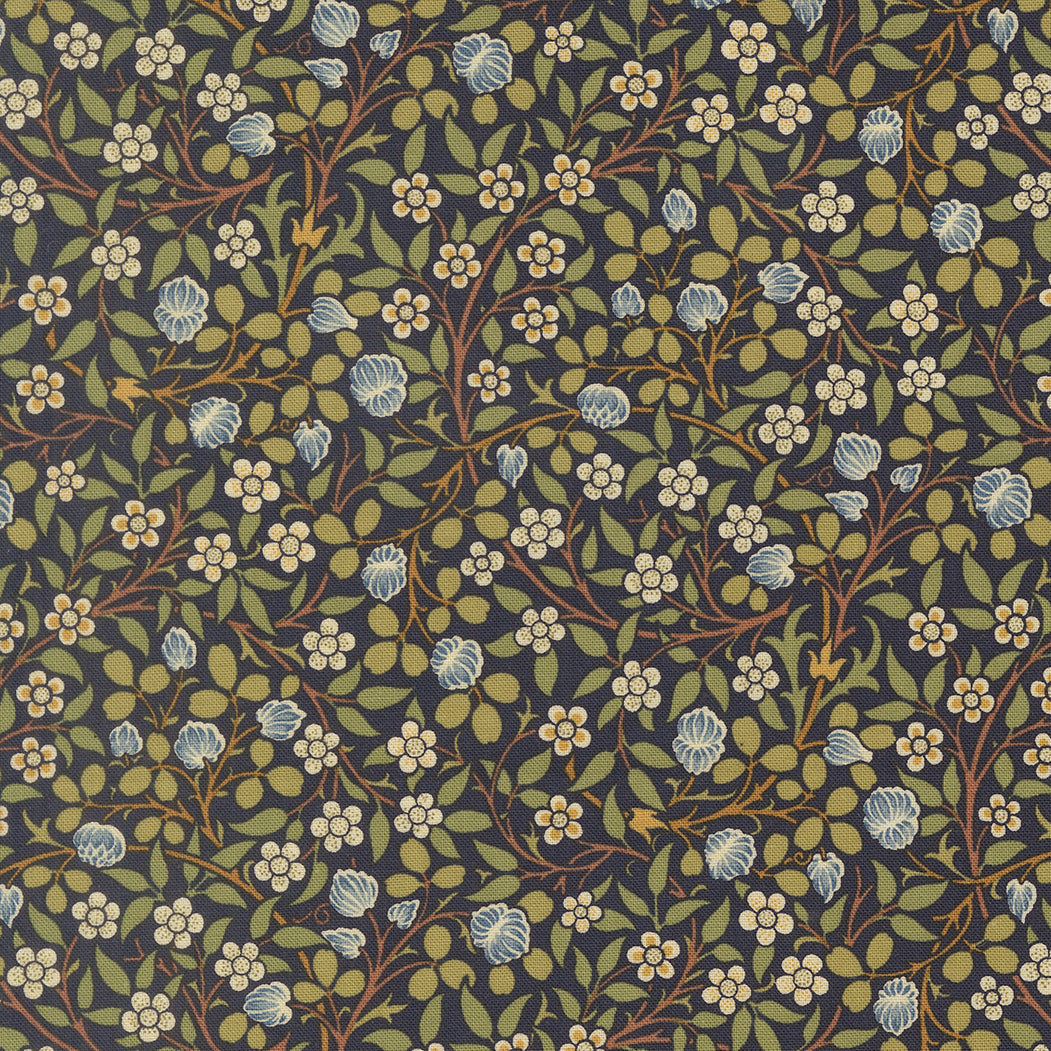 Morris Muse Clover Twilight quilting cotton by Barbara Brackman for Moda Fabrics featuring delicate blue clover blossoms, tiny white flowers, and trailing botanical vines on a twilight blue background.