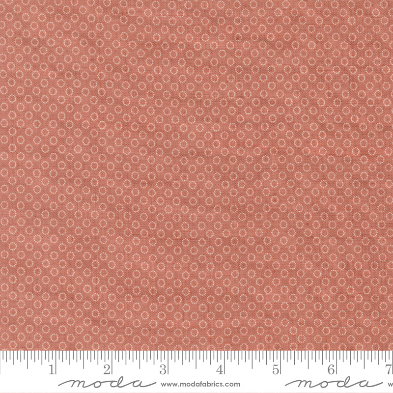 Tiny ring motif quilting cotton fabric on clay pink background by French General for Moda Fabrics
