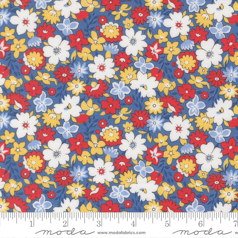 Close-up of 30s Playtime 2025 Bouncy Florals Bluebell fabric by Linzee McCray for Moda Fabrics, showing red, yellow, and white vintage-style flowers on a soft blue background.