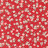Close-up of 30s Playtime 2025 Apple Blossom Florals Scarlet fabric by Linzee McCray for Moda Fabrics, featuring white blossoms and pink apples on a deep red background.