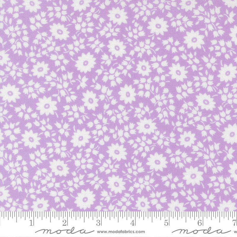 Close-up of 30s Playtime 2025 Perky Posies Lilac Fabric by Linzee McCray for Moda Fabrics, featuring white floral clusters on a soft lilac background.
