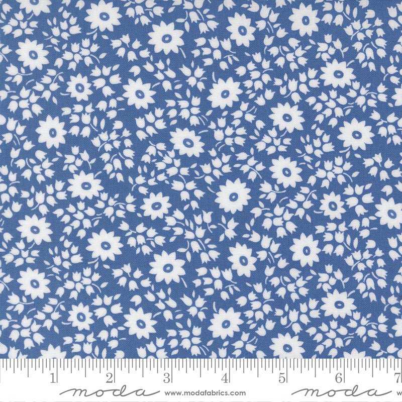 Close-up of 30s Playtime 2025 - Perky Posies Bluebell Fabric by Linzee McCray for Moda Fabrics, showing white floral patterns on a vintage-style bluebell background made of soft 100% cotton fabric.
