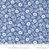 Close-up of 30s Playtime 2025 - Perky Posies Bluebell Fabric by Linzee McCray for Moda Fabrics, showing white floral patterns on a vintage-style bluebell background made of soft 100% cotton fabric.