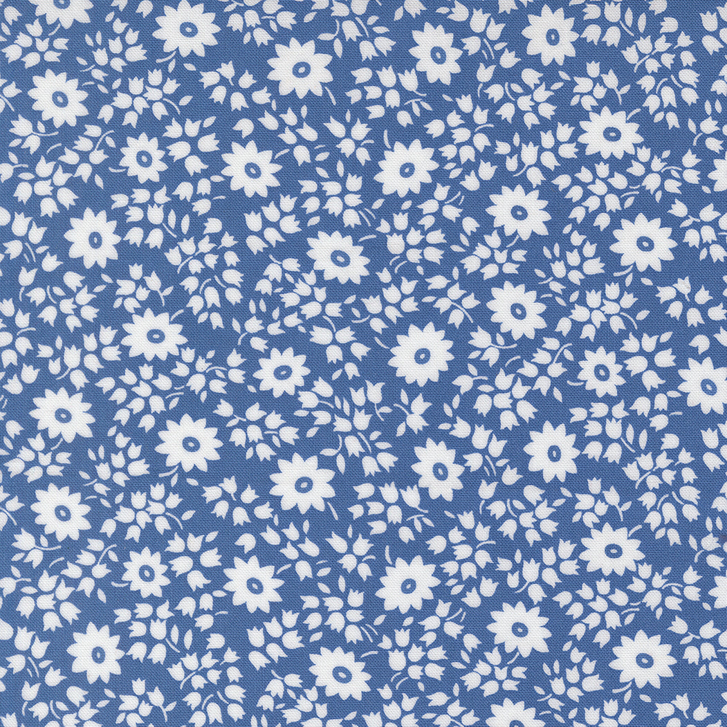 Close-up of 30s Playtime 2025 - Perky Posies Bluebell Fabric by Linzee McCray for Moda Fabrics, showing white floral patterns on a vintage-style bluebell background made of soft 100% cotton fabric.