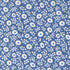 Close-up of 30s Playtime 2025 - Perky Posies Bluebell Fabric by Linzee McCray for Moda Fabrics, showing white floral patterns on a vintage-style bluebell background made of soft 100% cotton fabric.