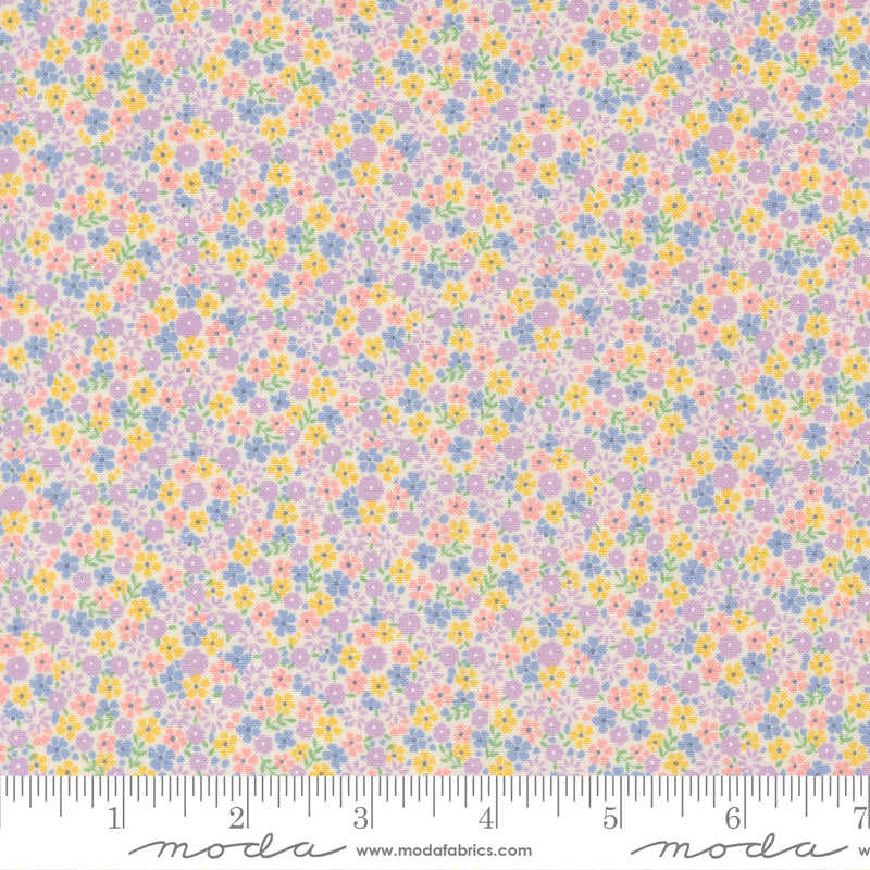 Close-up of 30s Playtime 2025 Calico Small Floral Pastel Fabric by Linzee McCray for Moda Fabrics showing tiny pastel flowers in lilac, yellow, blue, and pink on a cream background.