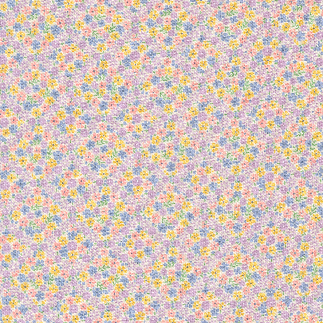 Close-up of 30s Playtime 2025 Calico Small Floral Pastel Fabric by Linzee McCray for Moda Fabrics showing tiny pastel flowers in lilac, yellow, blue, and pink on a cream background.