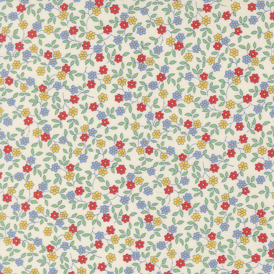 Close-up of 30s Playtime 2025 Blooming Vines Ditsy Primary Fabric by Linzee McCray for Moda Fabrics, showing red, yellow, and blue flowers with green vines on a soft cream cotton background.