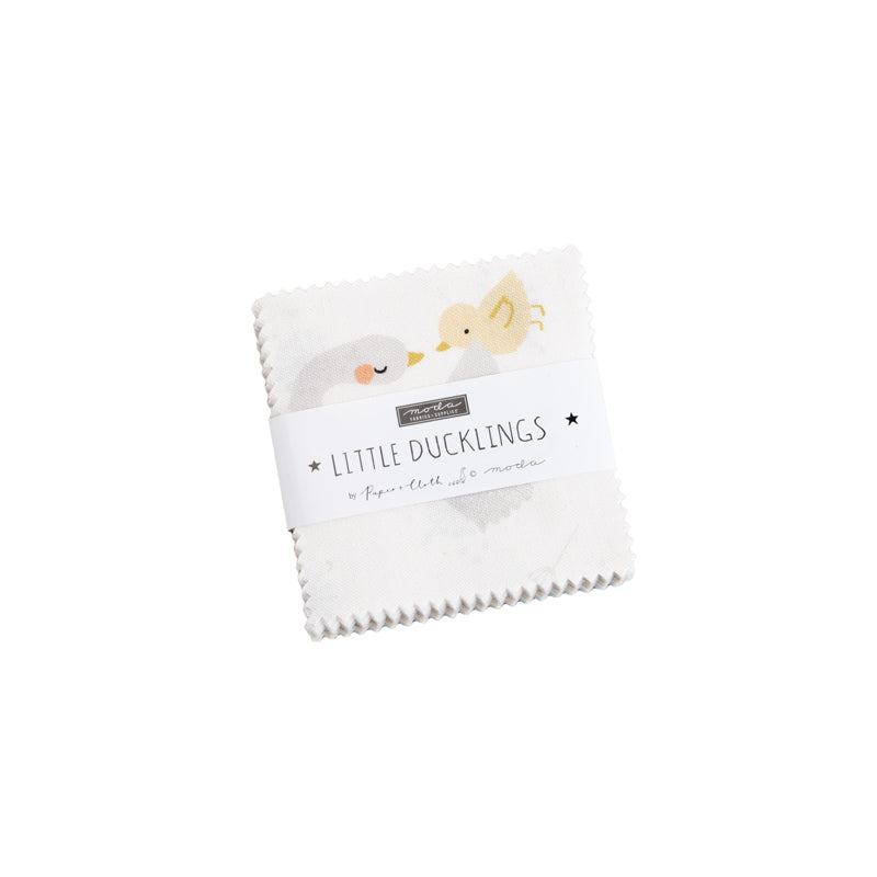 Little Ducklings Mini Charm Pack by Paper + Cloth Design Studios for Moda Fabrics featuring 42 premium 2.5-inch cotton fabric squares with adorable ducklings, florals, moons, dots, and soft nursery colors in yellow, blue, gray, and white.