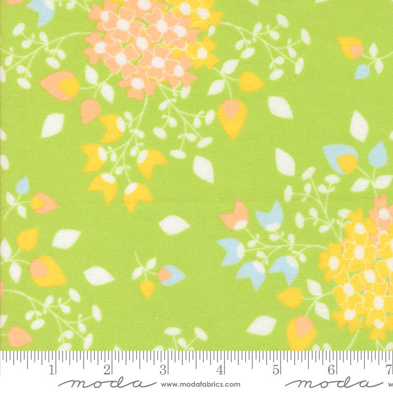 Sherbet Sunshine Leaf flannel fabric by Corey Yoder of Coriander Quilts for Moda Fabrics featuring pastel floral clusters on a green background.