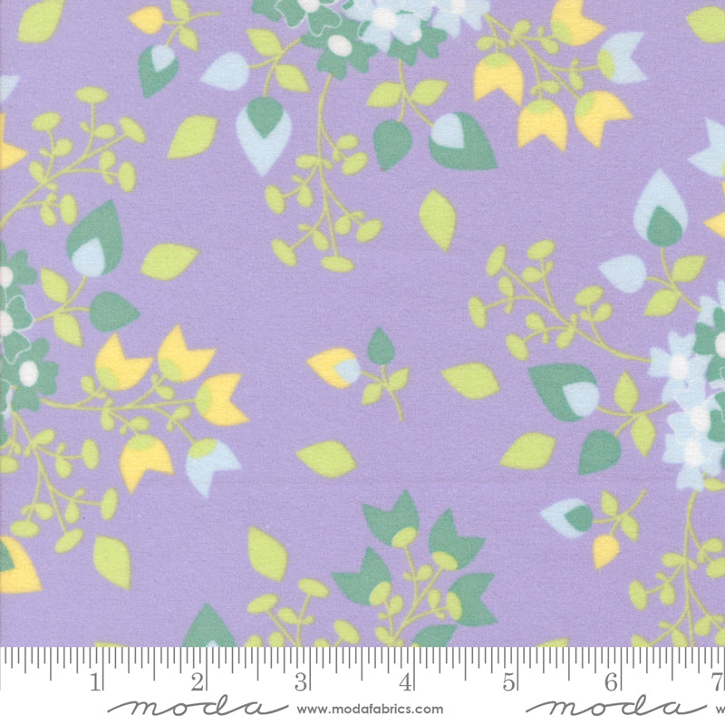 A close-up of Sherbet Sunshine Floral Bouquets Lavender Flannel Fabric by Corey Yoder for Moda Fabrics, showing soft cotton flannel with yellow and green floral sprays on a lavender background.
