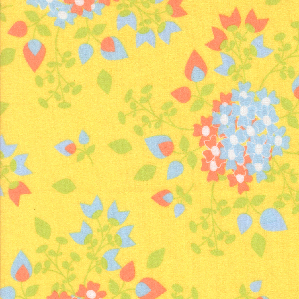 Sherbet Sunshine Sunshine flannel fabric by Corey Yoder of Coriander Quilts for Moda Fabrics featuring floral clusters in blue, coral, and green on yellow.