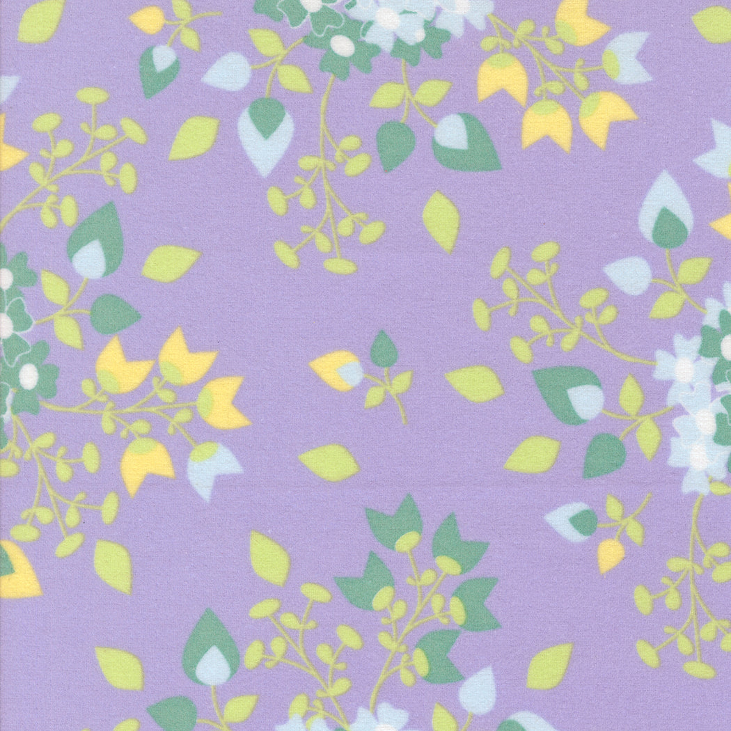 A close-up of Sherbet Sunshine Floral Bouquets Lavender Flannel Fabric by Corey Yoder for Moda Fabrics, showing soft cotton flannel with yellow and green floral sprays on a lavender background.