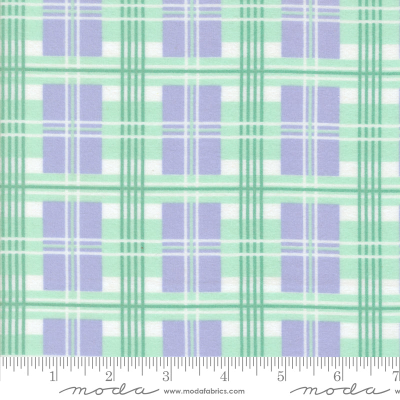 A close-up of Sherbet Sunshine Plaid Lavender Flannel Fabric by Corey Yoder for Moda Fabrics, featuring a soft plaid pattern in lavender, mint green, and white on cozy cotton flannel.