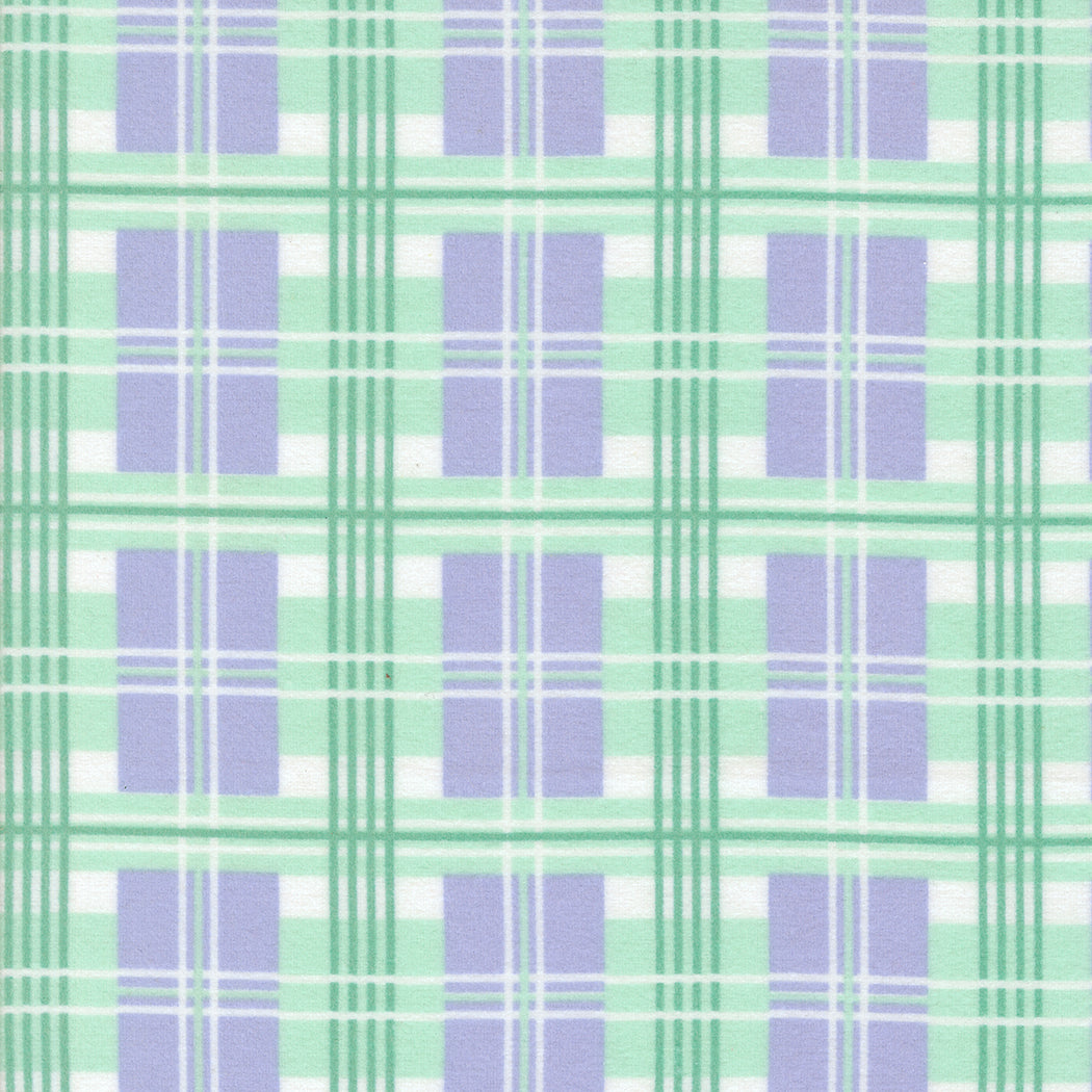 A close-up of Sherbet Sunshine Plaid Lavender Flannel Fabric by Corey Yoder for Moda Fabrics, featuring a soft plaid pattern in lavender, mint green, and white on cozy cotton flannel.