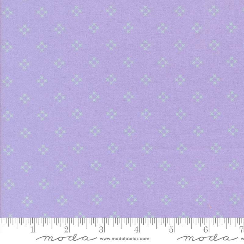 Sherbet Sunshine Flannel Diamond X Wisteria fabric by Corey Yoder of Coriander Quilts for Moda Fabrics featuring light lavender cross design on wisteria background.