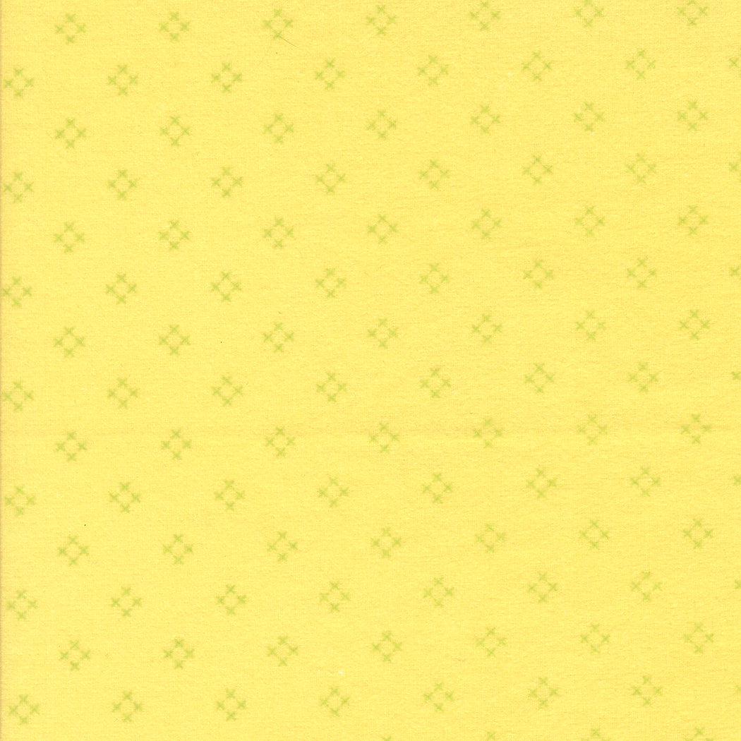 Sherbet Sunshine Flannel Diamond X Sunshine fabric by Corey Yoder of Coriander Quilts for Moda Fabrics featuring light green diamond crosses on yellow background.