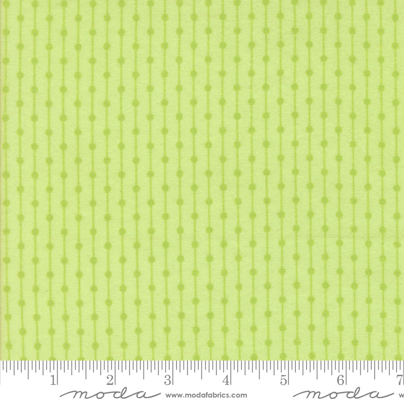 Sherbet Sunshine Flannel Stripe Honeydew fabric by Corey Yoder of Coriander Quilts for Moda Fabrics featuring dotted vertical stripe design in light green.
