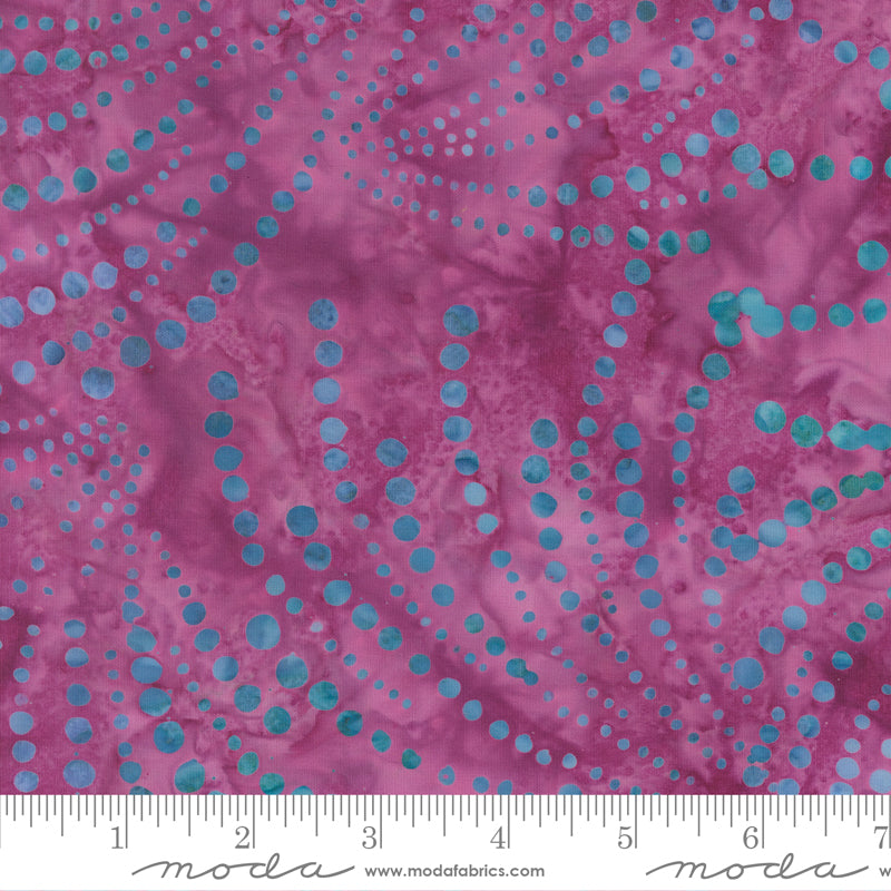 Sunburst Batiks Grape fabric by Moda Fabrics featuring swirling turquoise dotted sunburst patterns on a rich grape purple batik background.