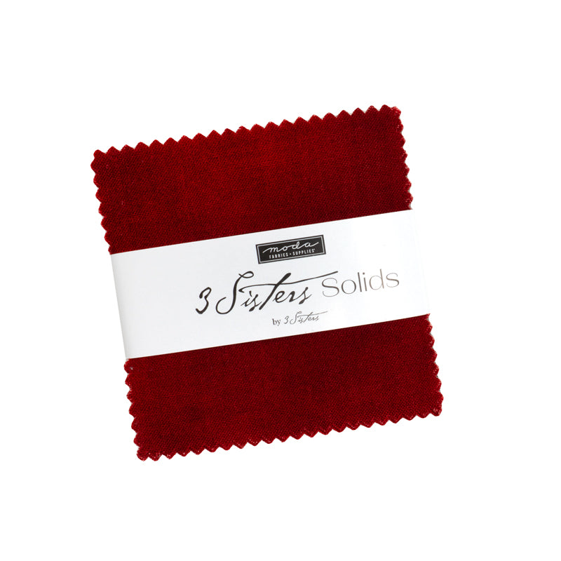3 Sisters Solids Mini Charm Pack by Moda Fabrics containing 42 assorted 2.5-inch solid fabric squares.