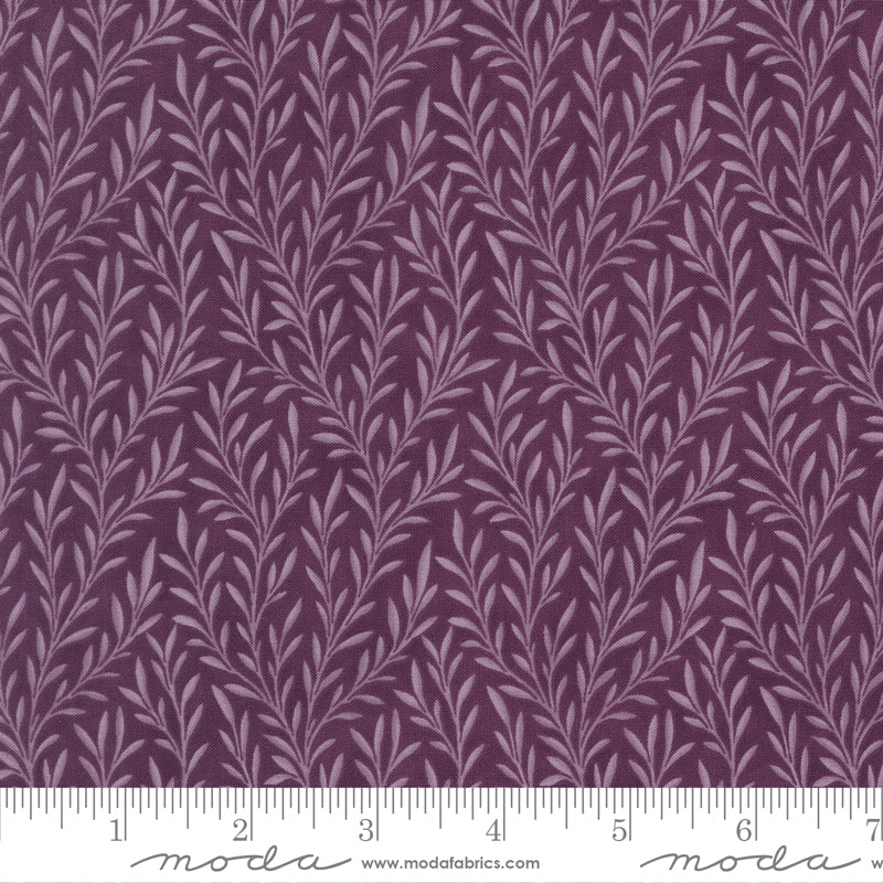 Collections Essence Trailing Vines Plum fabric by Howard Marcus for Moda Fabrics featuring elegant lavender trailing vines on a rich plum background.