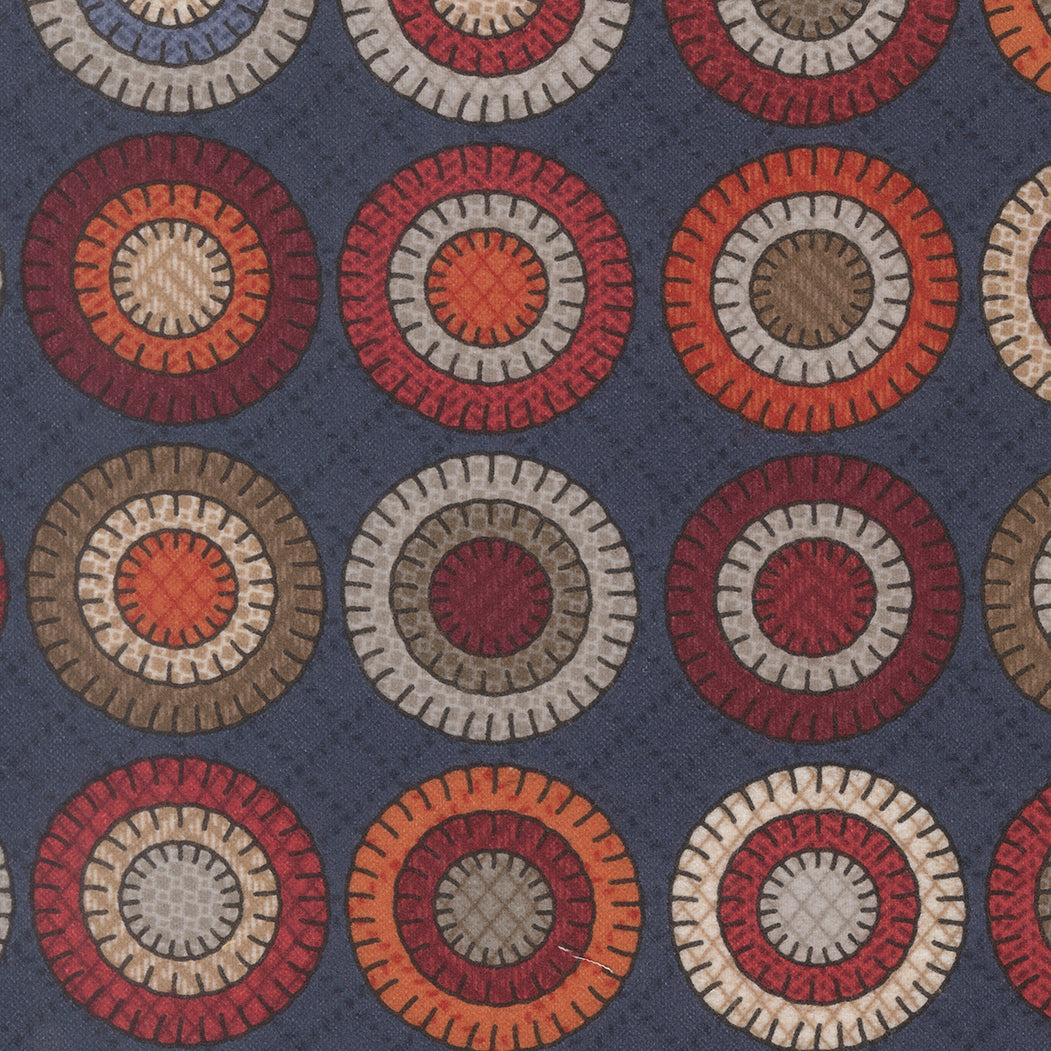 Penny Cheater Indigo flannel fabric by Primitive Gatherings for Moda Fabrics showing circular penny motifs on blue background.