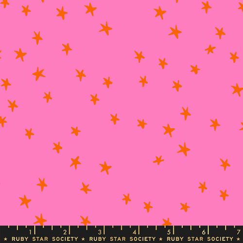 Starry Vivid Pink cotton fabric by Ruby Star Society with orange-red stars on a bright pink background.